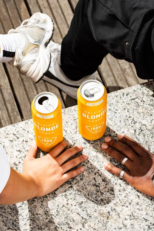 Canned beverage styled in a lifestyle setting