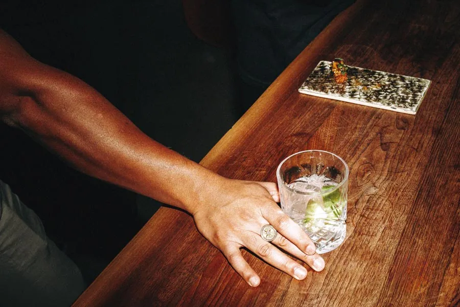 Cocktails being made and served at a bar