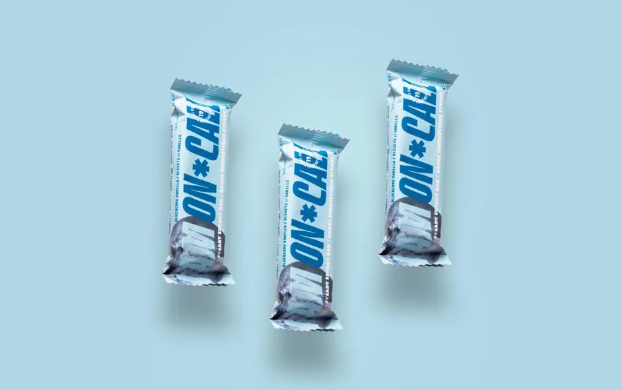 Packaged snack bars shot on bold coloured seamless backgrounds